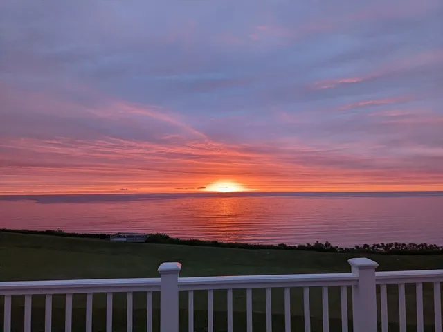 a view of an ocean and sunset