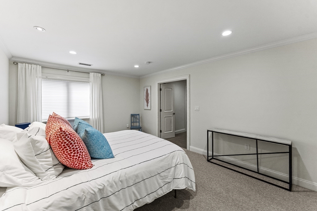 64 Cliffside Drive, Unit 64 Plymouth, MA 02360 - Photo 21 of 42 a bedroom with a bed and window