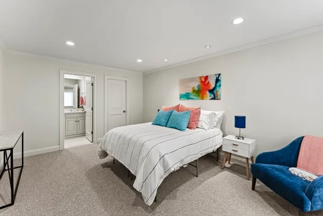 a bedroom with a bed and a couch