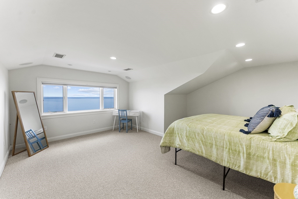 64 Cliffside Drive, Unit 64 Plymouth, MA 02360 - Photo 27 of 42 a bedroom with a bed and a window