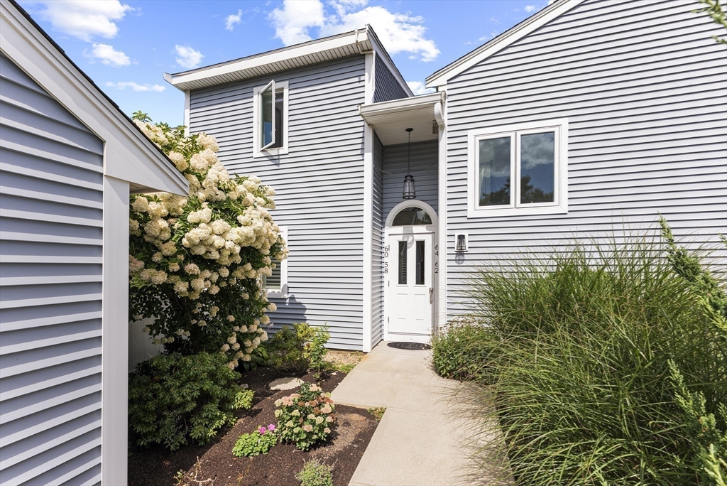 64 Cliffside Drive, Unit 64 Plymouth, MA 02360 - Photo 31 of 42 a view of a house with a yard and a garden