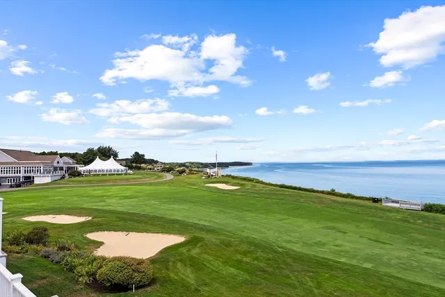 a view of a golf course with a swimming pool
