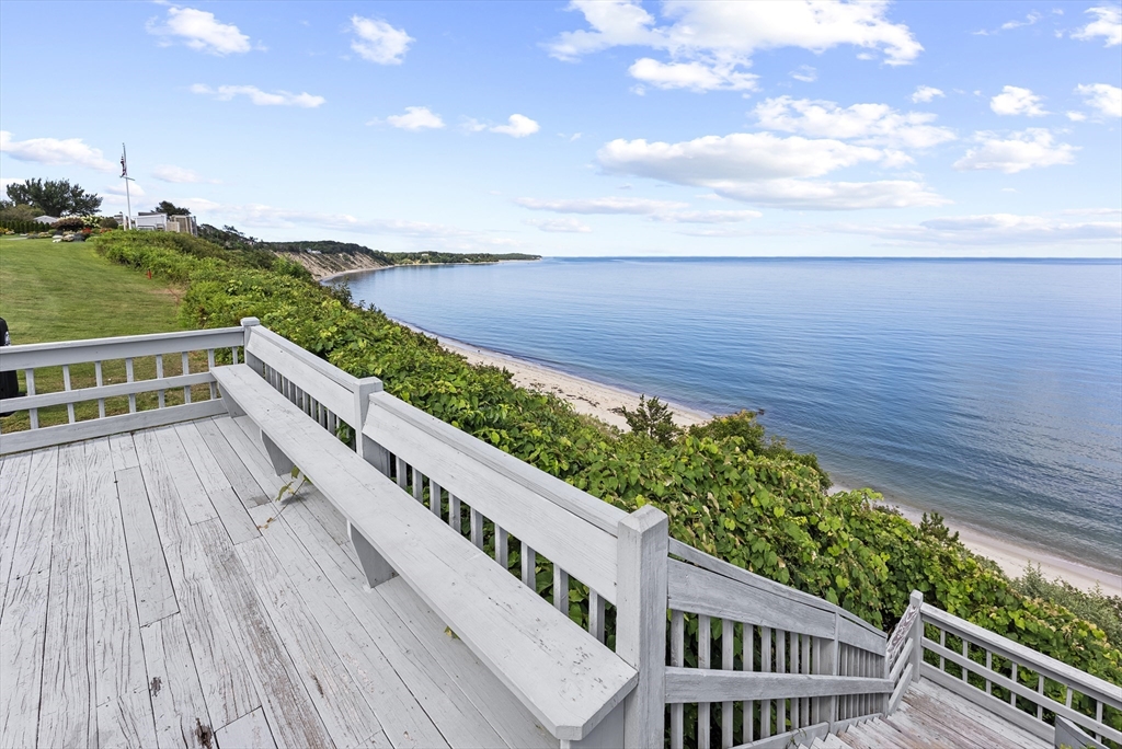 64 Cliffside Drive, Unit 64 Plymouth, MA 02360 - Photo 36 of 42 a view of a balcony with wooden floor and fence
