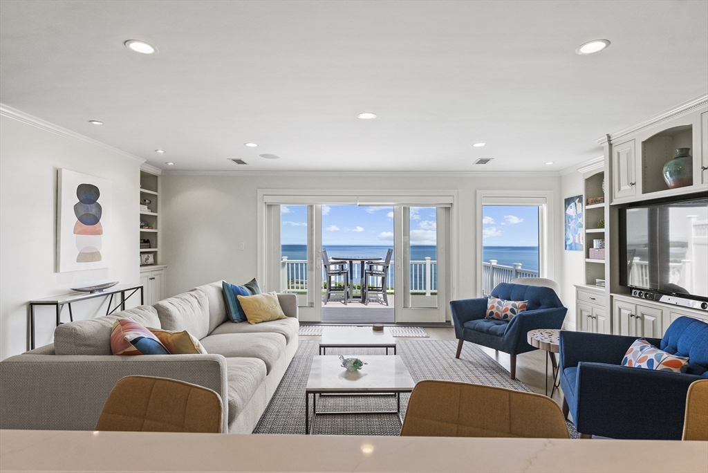 64 Cliffside Drive, Unit 64 Plymouth, MA 02360 - Photo 4 of 42 a living room with furniture and large windows