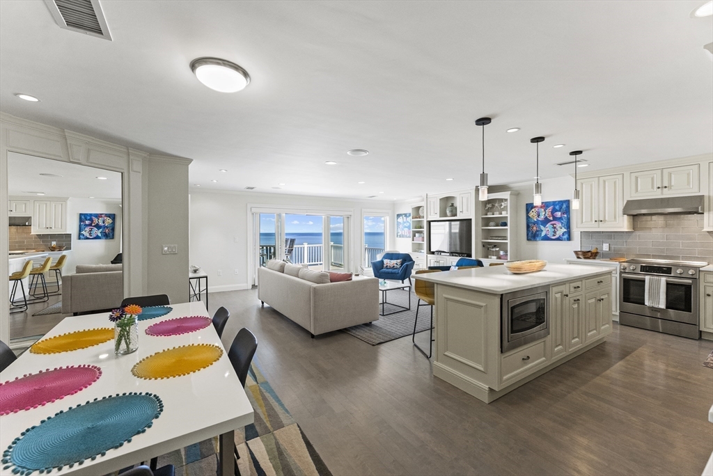 64 Cliffside Drive, Unit 64 Plymouth, MA 02360 - Photo 9 of 42 a kitchen that has a lot of cabinets a sink and a stove in it