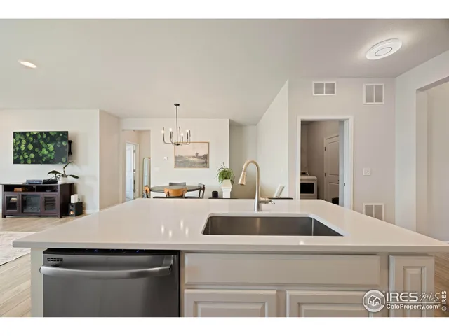 a kitchen with a sink a counter top space and appliances