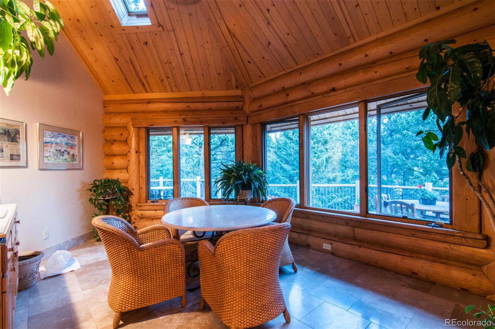 590 West Meadow Road Evergreen, CO 80439 - Photo 33 of 40 a dining room with furniture and wooden floor