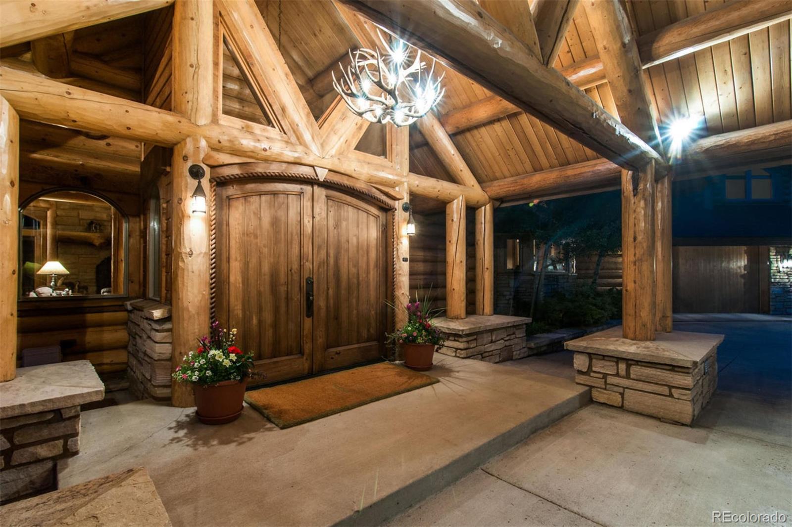 590 West Meadow Road Evergreen, CO 80439 - Photo 4 of 40 a lobby with furniture and potted plants