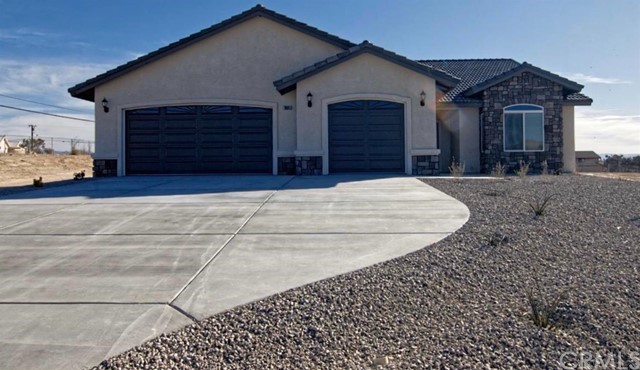 15305 Myalon Road Apple Valley, CA 92307 - Photo 1 of 1 a view of a house with a garage
