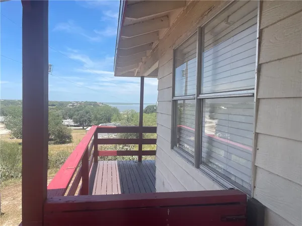 a view of a deck with wooden floor and outdoor space