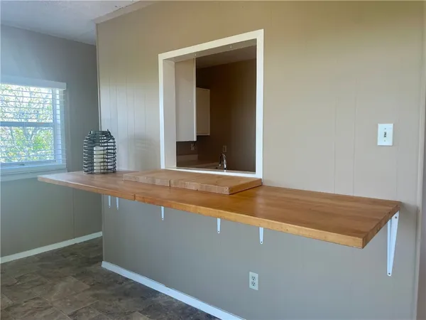 a kitchen with stainless steel appliances granite countertop a refrigerator and a stove