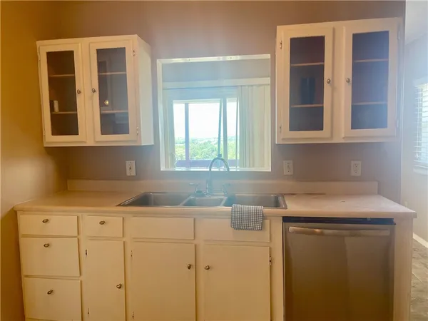 a room with water heater and a window