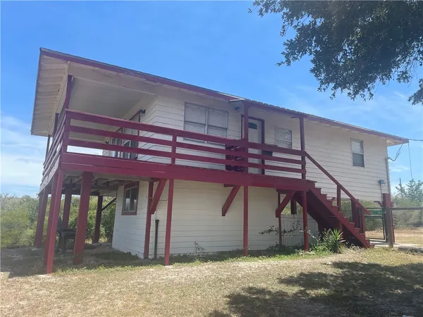 a front view of a house with a porch