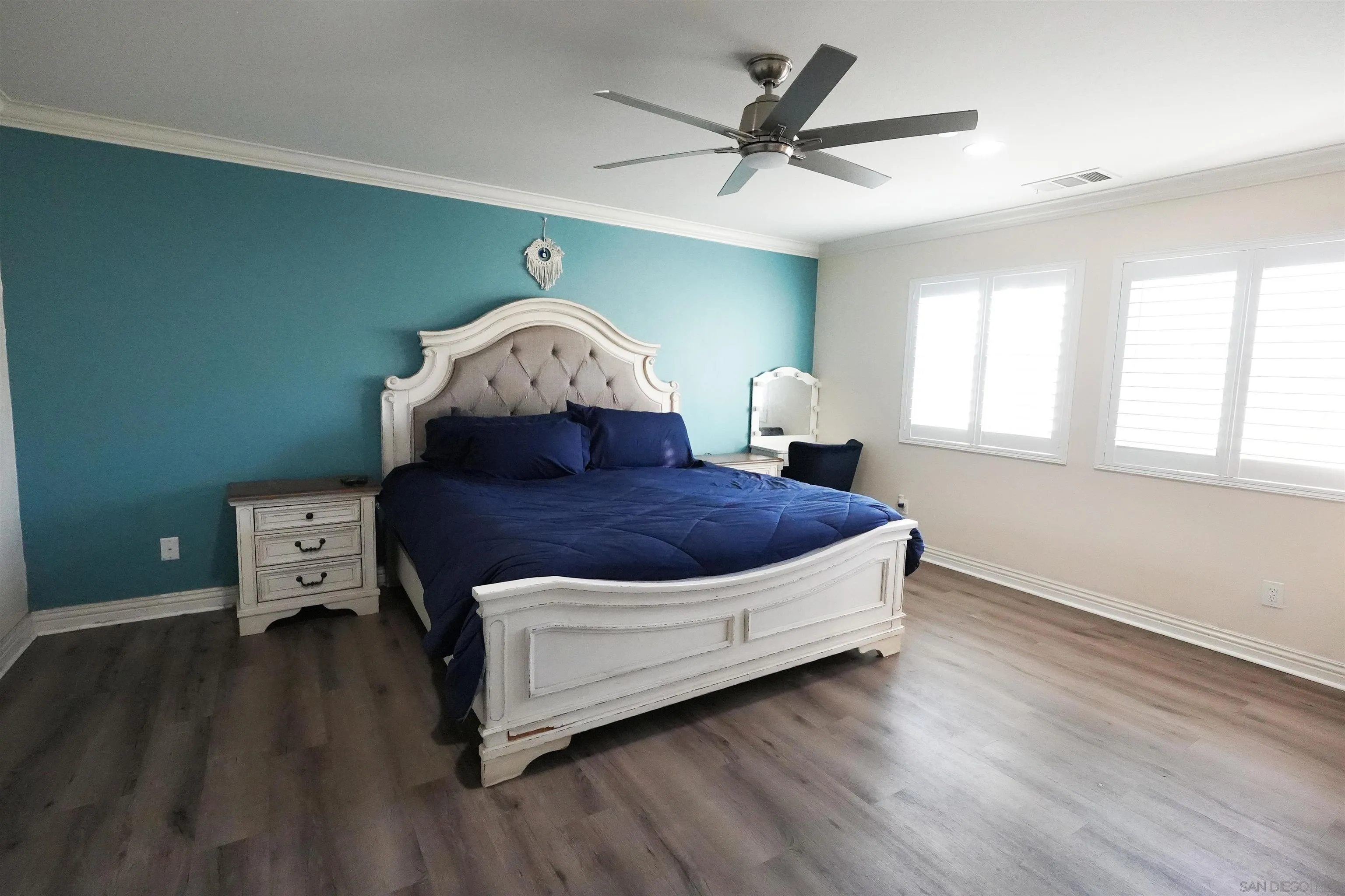 3326 Crowfoot Road San Bernardino, CA 92407 - Photo 11 of 20 a living room with a bed furniture and a window