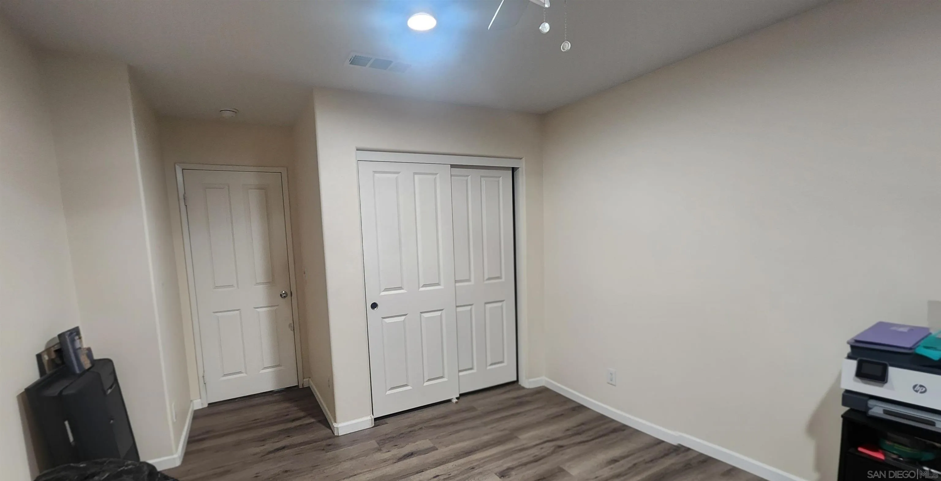 3326 Crowfoot Road San Bernardino, CA 92407 - Photo 13 of 20 an empty room with wooden floor