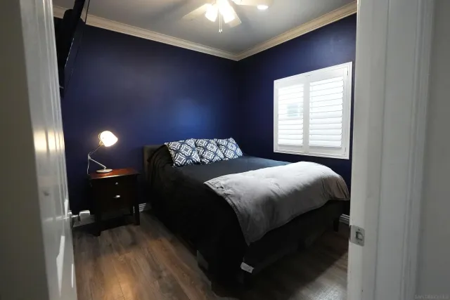 a bedroom with a bed and a mirror