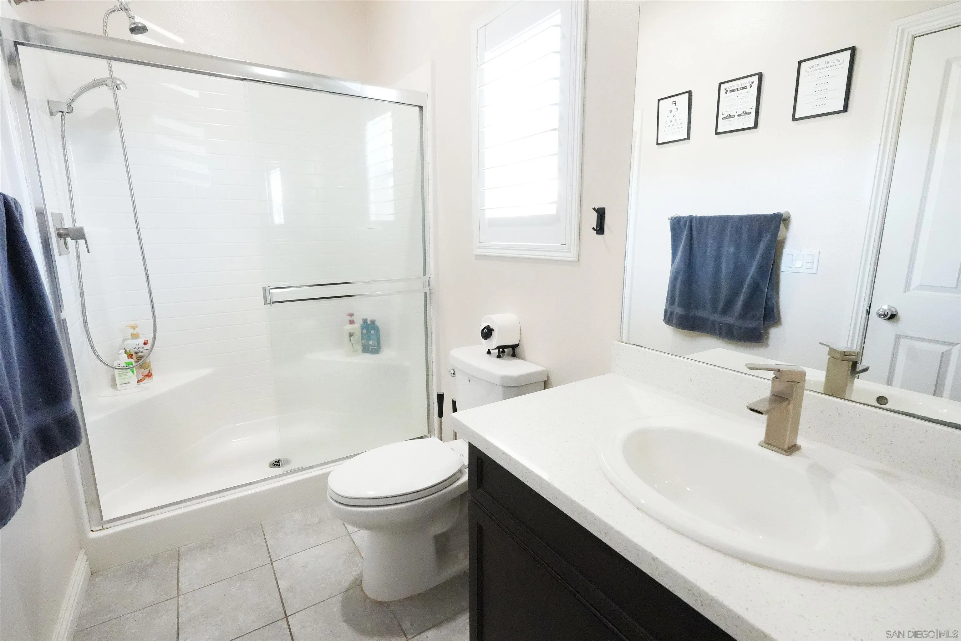 3326 Crowfoot Road San Bernardino, CA 92407 - Photo 8 of 20 a bathroom with a sink a toilet and shower