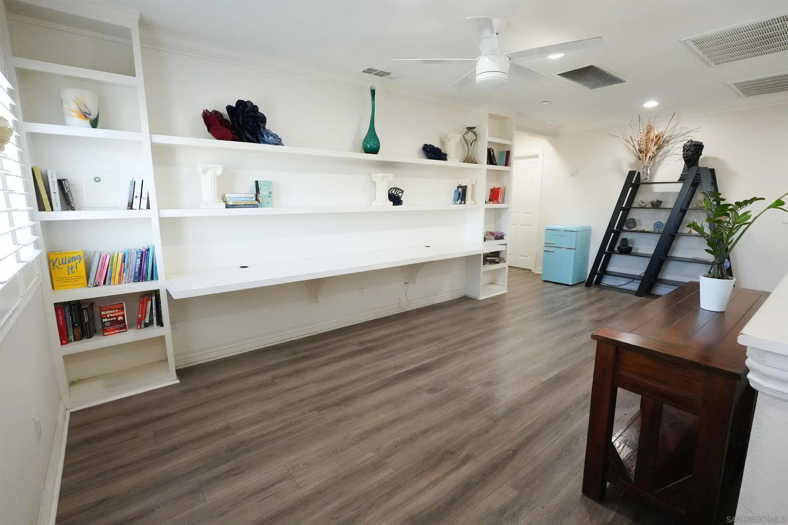 3326 Crowfoot Road San Bernardino, CA 92407 - Photo 9 of 20 a living room with furniture and a wooden floor