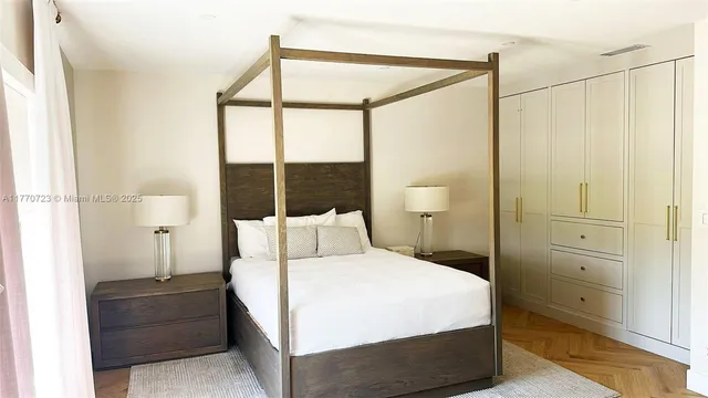 a spacious bedroom with a bed and a couch