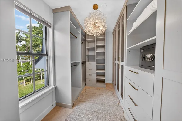 a kitchen with stainless steel appliances granite countertop sink stove and wooden floor