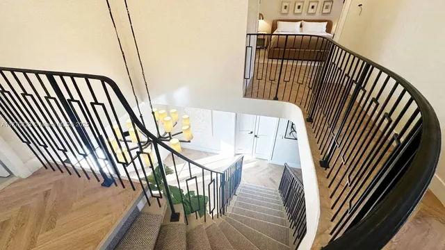 a view of a swimming pool with lounge chairs