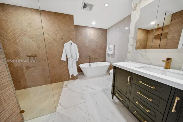 a view of a storage and utility room with washer and dryer