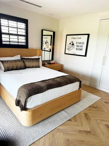 a view of a house with swimming pool and sitting area