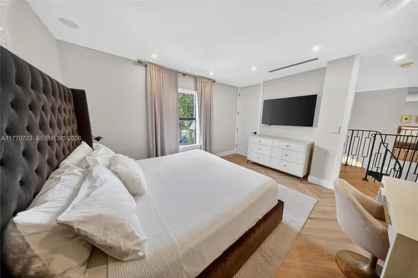 a view of a terrace with a table and chairs