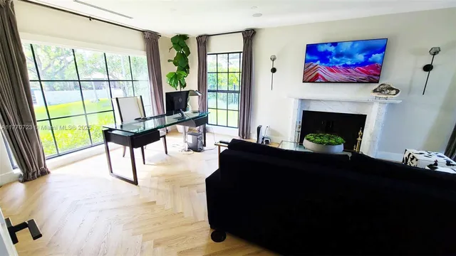 a living room with furniture and a window