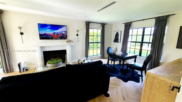 a view of a dining room with furniture and window