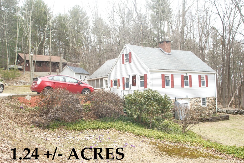 187-191 Shepard Road Sturbridge, MA 01566 - Photo 1 of 18 a front view of a house with a yard