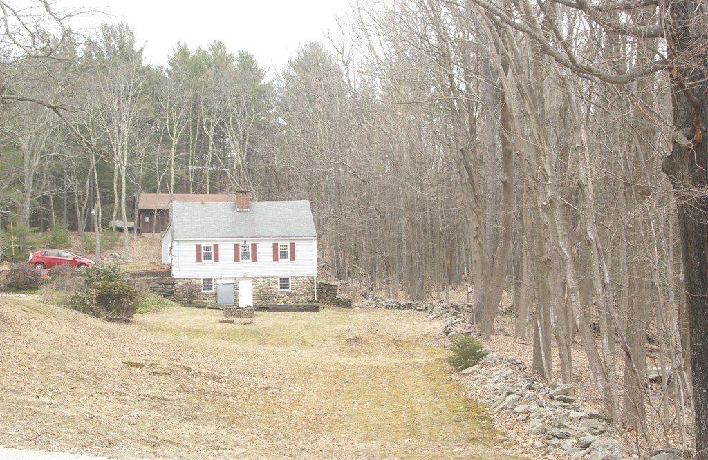 187-191 Shepard Road Sturbridge, MA 01566 - Photo 2 of 18 a white house that has a tree in front of it
