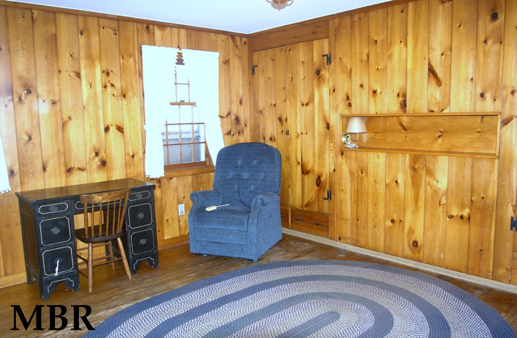 187-191 Shepard Road Sturbridge, MA 01566 - Photo 10 of 18 a bedroom with a chair and next to a window