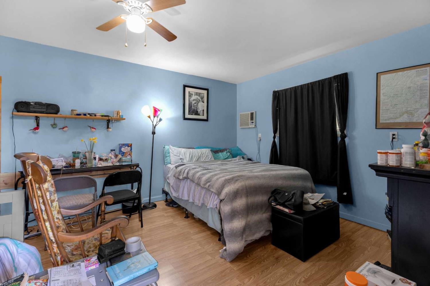 13489 Yorkshire Road Groveland, CA 95321 - Photo 23 of 35 a bedroom with a bed and a chandelier