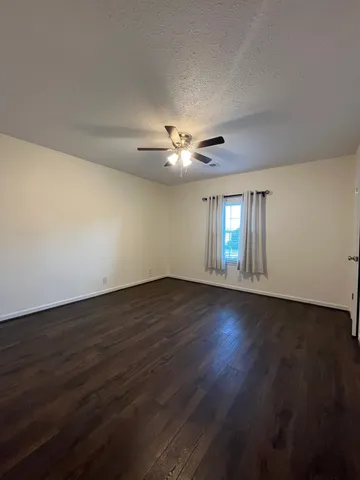 a view of wooden floor and chandelier in a room
