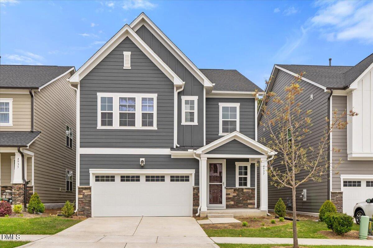 4937 Abundance Avenue Raleigh, NC 27616 - Photo 3 of 36 a front view of a house with garden
