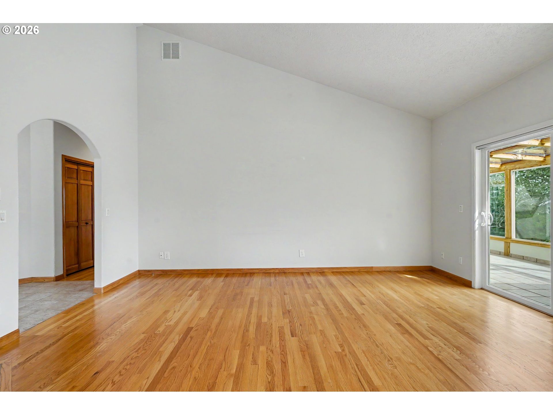 1470 Ranier Loop Northwest Salem, OR 97304 - Photo 23 of 48 a view of an empty room and wooden floor