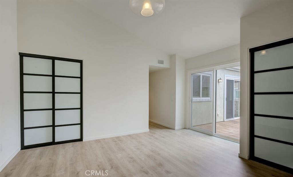 34028 Selva Road, Unit 77 Dana Point, CA 92629 - Photo 17 of 62 a view of empty room with wooden floor and fan