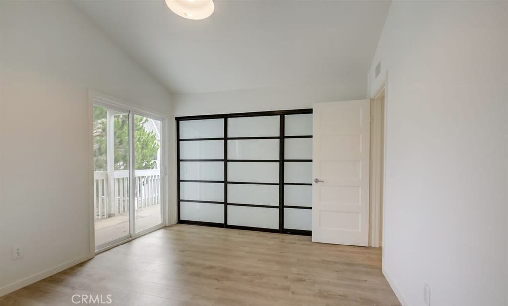 34028 Selva Road, Unit 77 Dana Point, CA 92629 - Photo 19 of 62 wooden floor in an empty room with a window