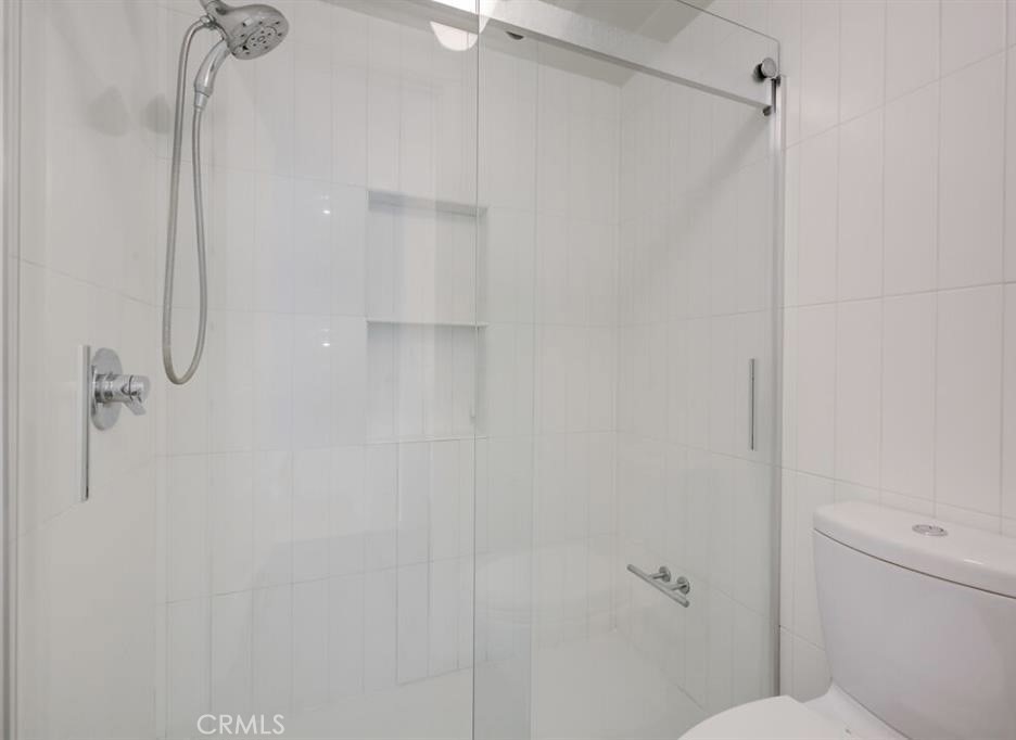 34028 Selva Road, Unit 77 Dana Point, CA 92629 - Photo 26 of 62 a bathroom with a shower and toilet