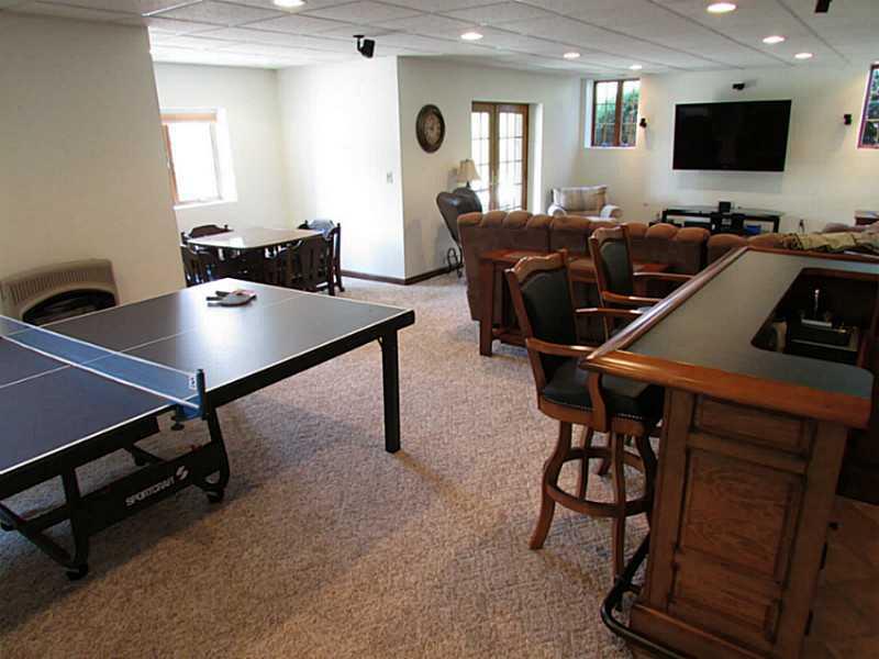 130 Craft Road Washington, PA 15301 - Photo 18 of 25 Basement/Game Room. The bar is equipped with a sink and large enough to fit several bar stools.