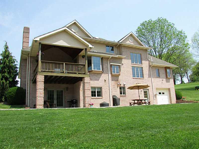 130 Craft Road Washington, PA 15301 - Photo 6 of 25 Exterior Back. Private deck, patio accessible from Gameroom and 2 car tandem garage with 7.5 ceilings!