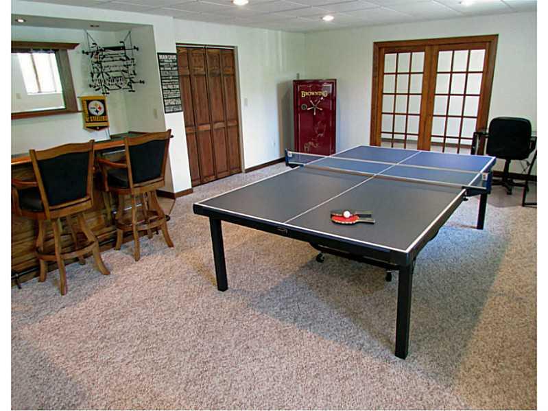 130 Craft Road Washington, PA 15301 - Photo 8 of 25 Basement/Game Room. A full 41 feet long, the Gameroom walks out to the patio from 2 exits.