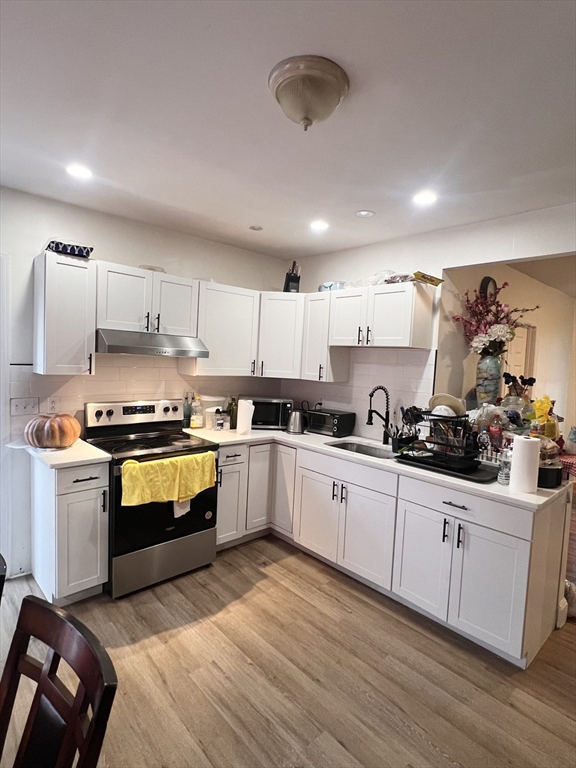 18 Greenacre Square Springfield, MA 01105 - Photo 3 of 22 a kitchen with stainless steel appliances granite countertop a sink a stove and cabinets