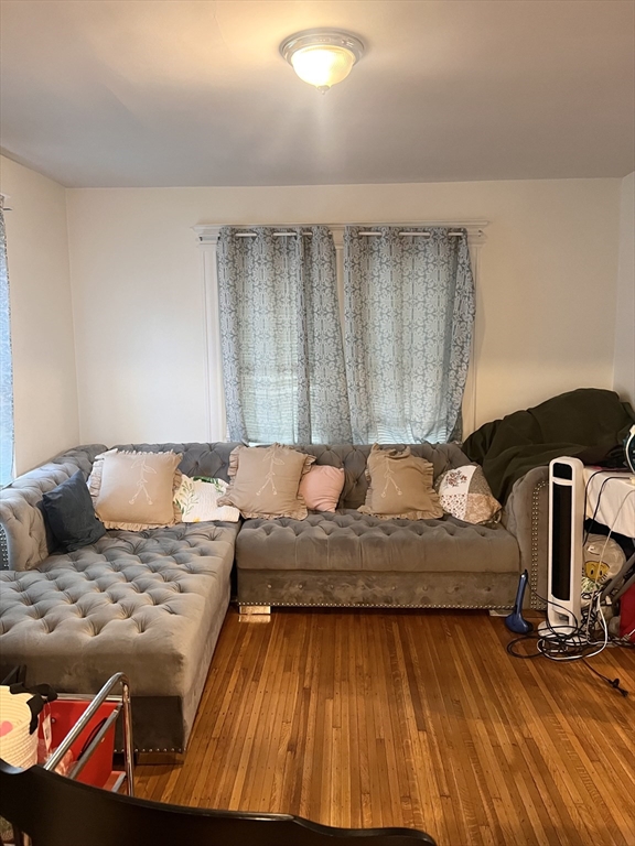 18 Greenacre Square Springfield, MA 01105 - Photo 6 of 22 a living room with a couch and dresser