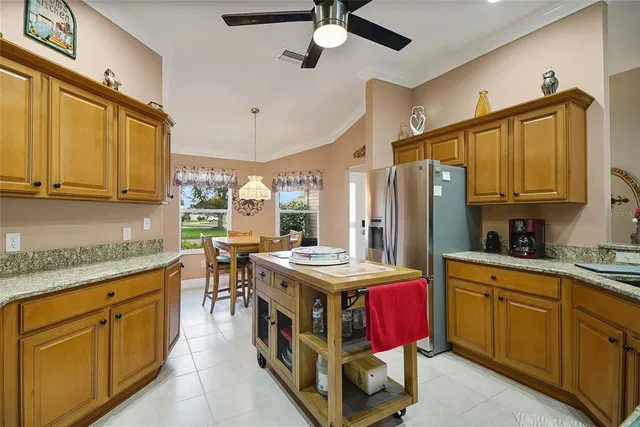 a view of a dining room with furniture and window