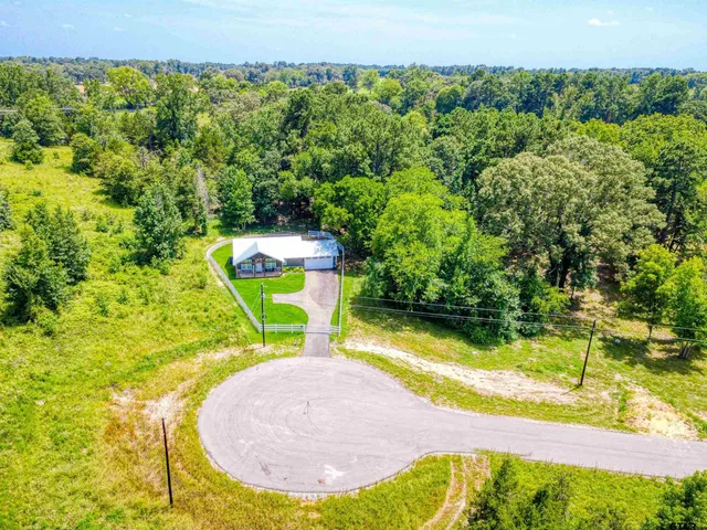 a view of a swimming pool with a yard