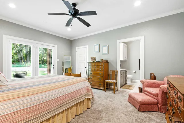 a bedroom with furniture and a window