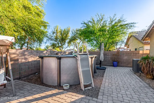 a view of a chairs setting in the backyard