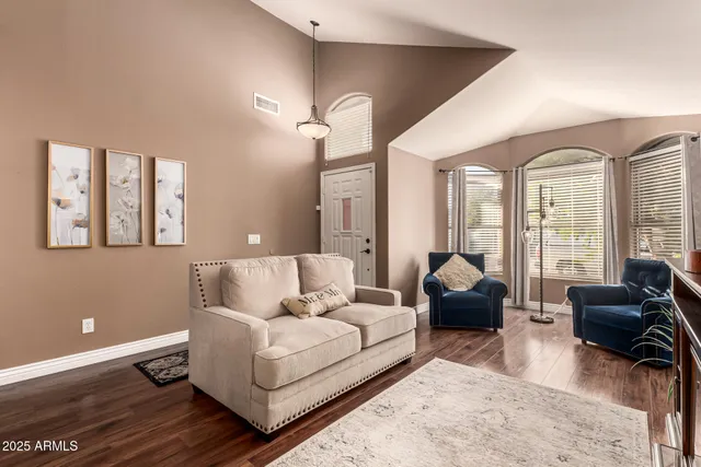 a living room with furniture and a large window